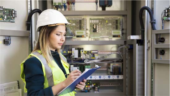 SEAM group female engineer inspecting energized assets