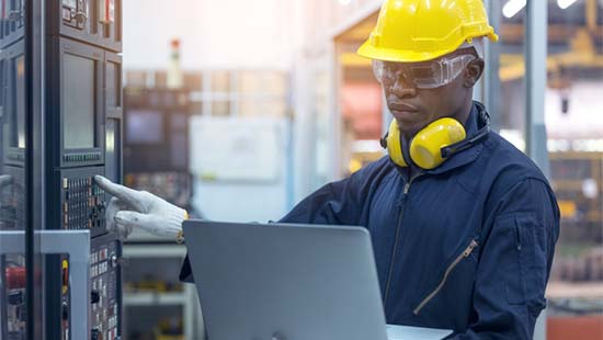 electrical technician uses computer to collect data