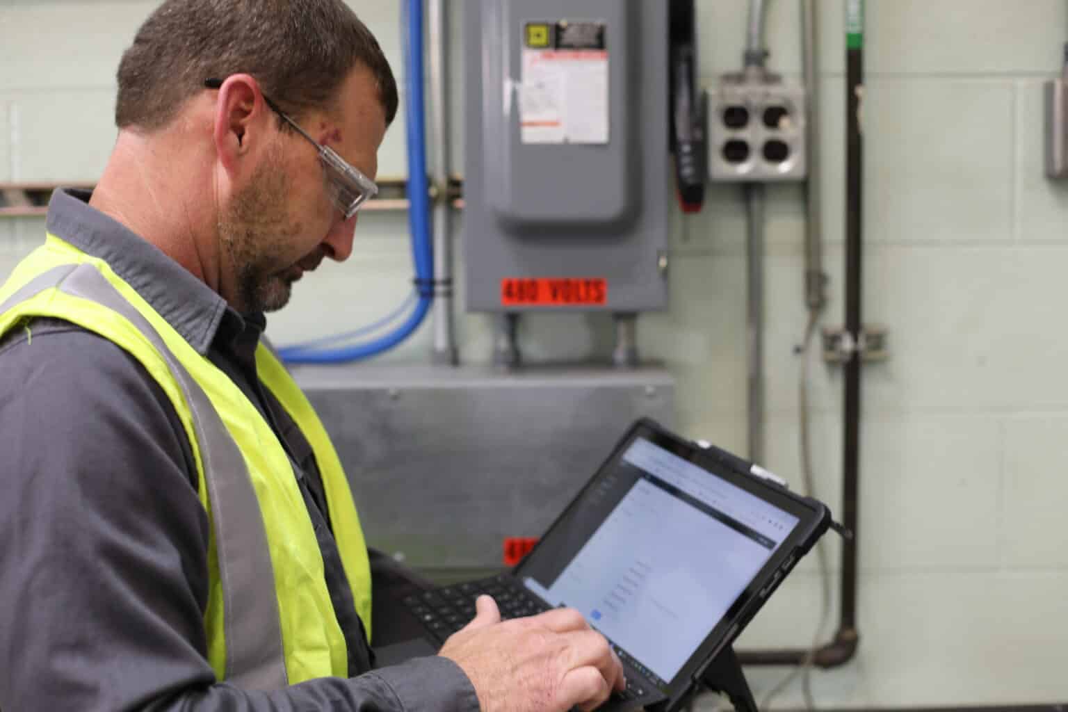 SEAM Group technician holding computer